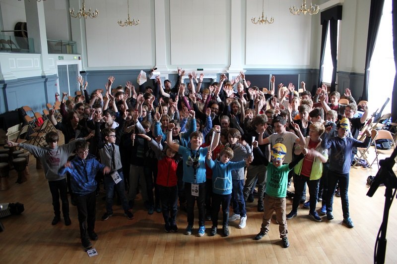 The whole Bandit group with hands in the air